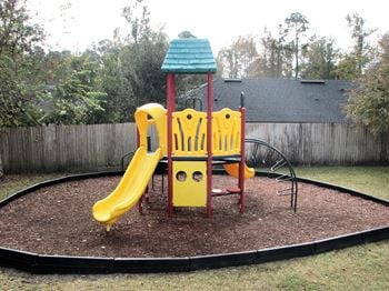 Playground with slide and climbing structure